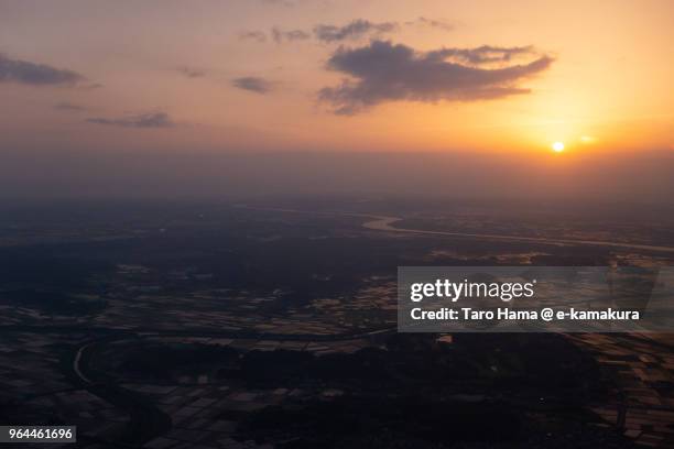 rice paddy and tone river in narita city in japan sunset time aerial view from airplane - narita city stock pictures, royalty-free photos & images