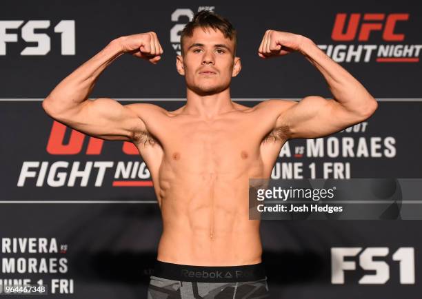 Nathaniel Wood of England poses on the scale during the UFC weigh-in at the DoubleTree Hotel on May 31, 2018 in Utica, New York.