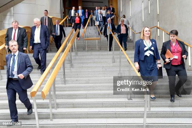 MSPs including Scottish Conservative leader Ruth Davidson flood out of the chamber of the Scottish Parliament after First Minister's Questions, on...