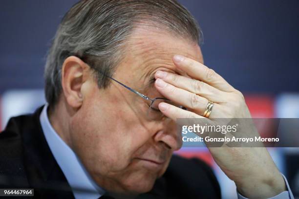 Real Madrid CF president Florentino Perez reacts as he listens to Zinedine Zidane during a press conference to announce his resignation as Real...
