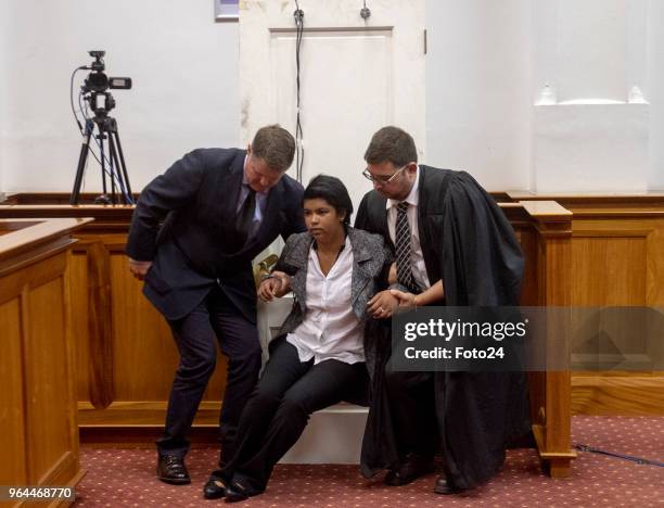 Murder accused Jason Rohde uses a police officer as a model to demonstrate how he found his wife Susans body during his trial at the Western Cape...