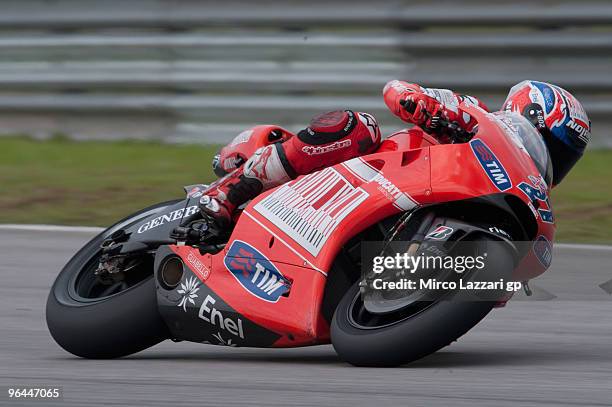 Casey Stoner of Australia and Ducati Marlboro Team rounds the bend during the final day of the MotoGP test at Sepang International Circuit on...