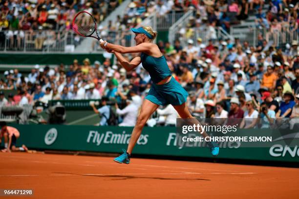 Croatia's Donna Vekic plays a backhand return to Russia's Maria Sharapova during their women's singles second round match on day five of The Roland...