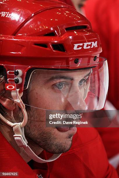 Drew Miller of the Detroit Red Wings watches the game from the bench during an NHL game against the Phoenix Coyotes at Joe Louis Arena on January 26,...