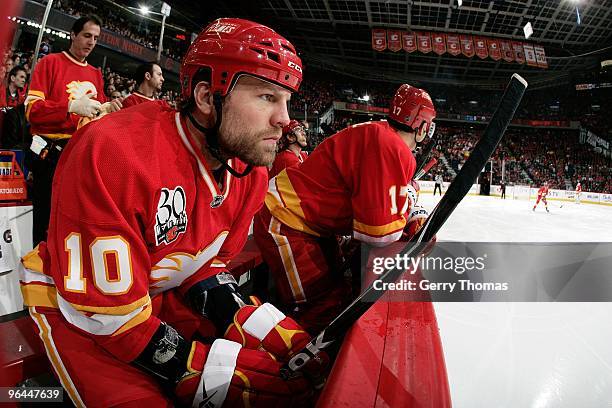 Brian McGrattan of the Calgary Flames watches the game on the bench in between shifts against the Edmonton Oilers on January 30, 2010 at Pengrowth...