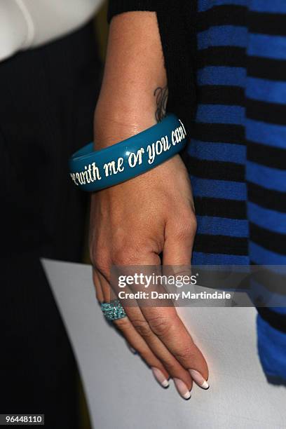 Vanessa Perroncel's bracelet detail is seen as she attends a press conference regarding recent allegations of an affair with John Terry on February...