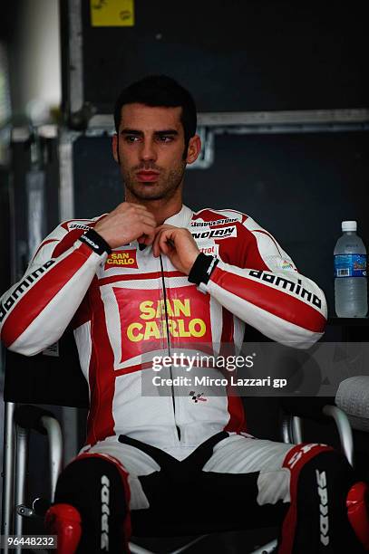 Marco Melandri of Italy and San Carlo Honda Gresini looks on in box during the final day of the MotoGP test at Sepang International Circuit, near...