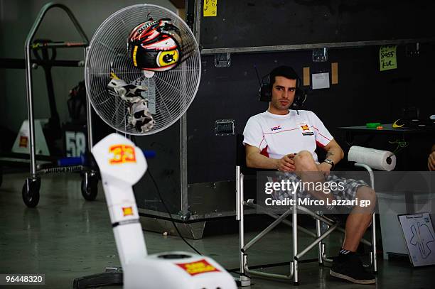 Marco Melandri of Italy and San Carlo Honda Gresini takes a break in box during the final day of the MotoGP test at Sepang International Circuit,...