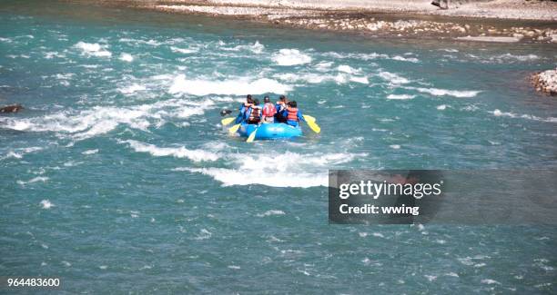 tourists drifting the jasper athabasca river in september - athabasca river stock pictures, royalty-free photos & images