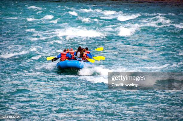 tourists drifting the jasper athabasca river in september - athabasca river stock pictures, royalty-free photos & images