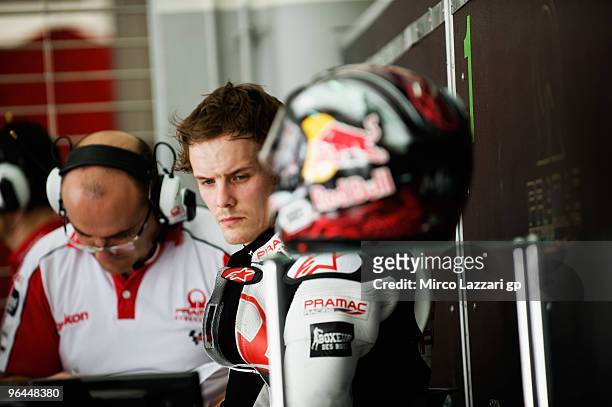 Mika Kallio of Finland and Pramac Green Tea looks on in box during the final day of the MotoGP test at Sepang International Circuit, near Kuala...