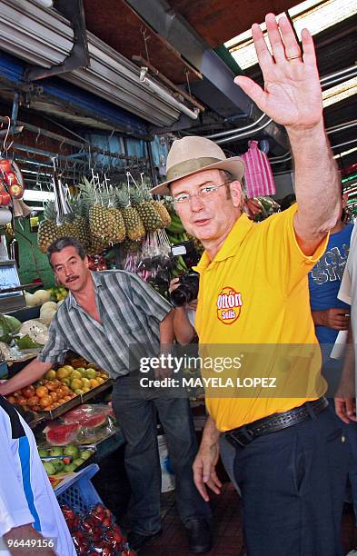 Costa Rican presidential candidate for the Citizen Action Party, Otton Solis, waves to supporters on February 5 during a visit to the Central Market...
