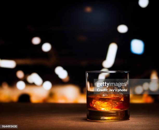 whisky in city abstract background - ice cubes background ストックフォトと画像