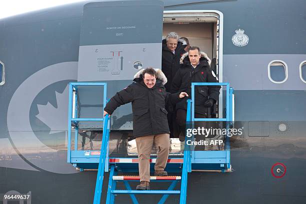 Canadian Finance Minister Jim Flaherty , and Bank of Canada Governor Mark Carney arrive at the airport in Iqaluit, Canada for the G7 Finance...