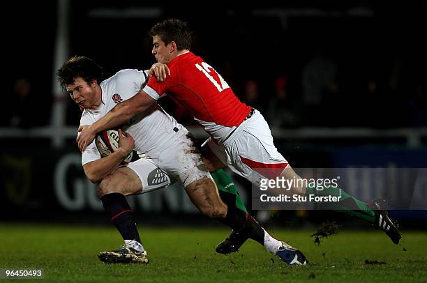 England winger Sam Smith is tackled by Wales centre Scott Williams during the International match between England U20 and Wales U20 International...