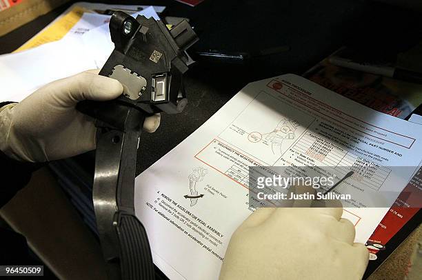 Toyota service technician Tungyio Saelee performs a recall repair on an accelerator pedal from a brand new Toyota Camry at City Toyota February 5,...