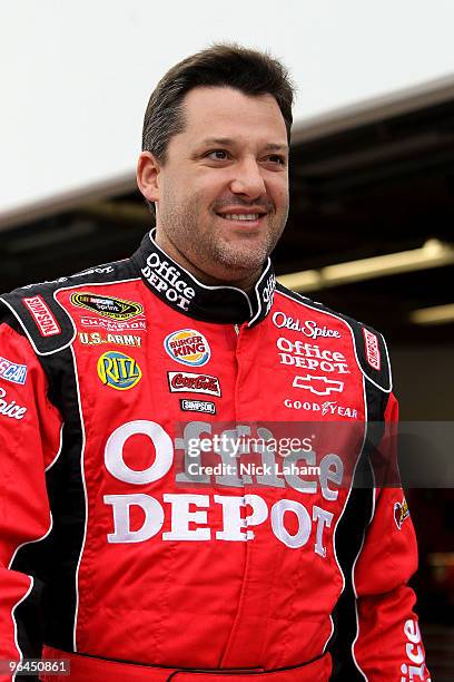 Tony Stewart, driver of the Old Spice/Office Depot Toyota, walks in the garage area during practice for the NASCAR Sprint Cup Series Daytona 500 at...