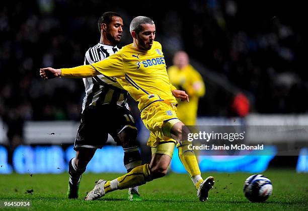 Wayne Routledge of Newcastle United battles with Kevin McNaughton of Cardiff City during the Coca Cola Championship game between Newcastle United and...