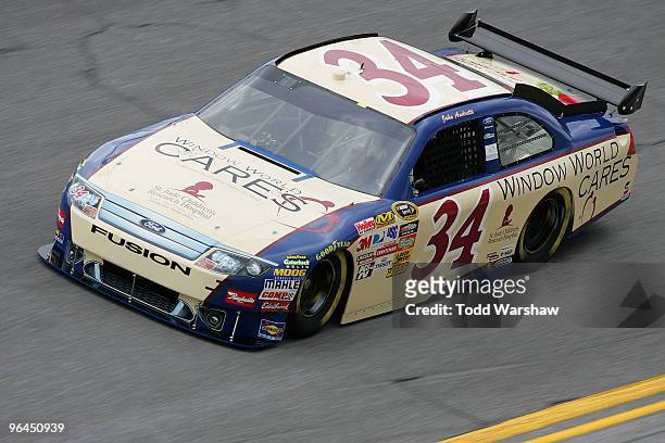 John Andretti drives the Window World Cares Ford during practice for the NASCAR Sprint Cup Series Daytona 500 at Daytona International Speedway on...