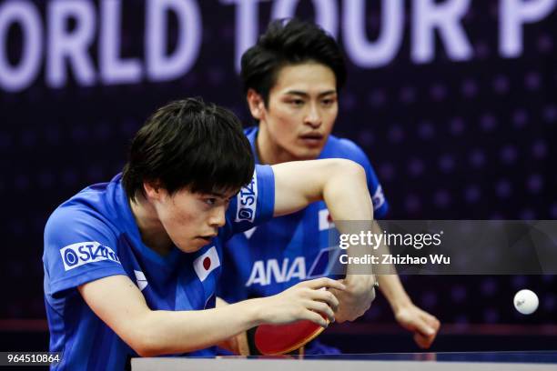 Morizono Masataka and Oshima Yuya of Japan in action at the men's doubles match compete with Pistej Lubomir of Slovenska and Pitchford Liam of...