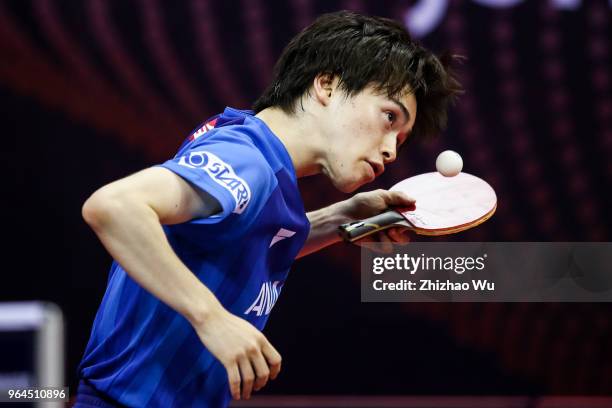 Morizono Masataka of Japan in action at the men's doubles match compete with Pistej Lubomir of Slovenska and Pitchford Liam of England during the...