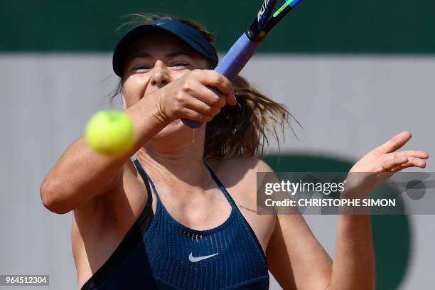 Russia's Maria Sharapova plays a forehand return to Croatia's Donna Vekic during their women's singles second round match on day five of The Roland...