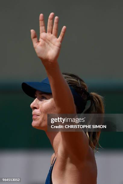 Russia's Maria Sharapova celebrates after victory over Croatia's Donna Vekic during their women's singles second round match on day five of The...
