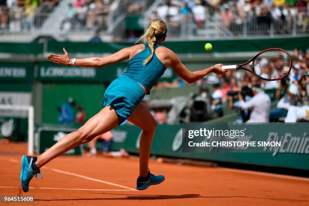 Croatia's Donna Vekic plays a forehand return to Russia's Maria Sharapova during their women's singles second round match on day five of The Roland...