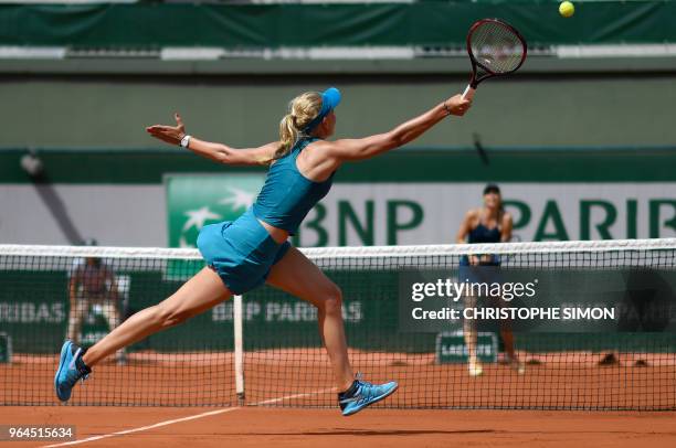 Croatia's Donna Vekic plays a forehand return to Russia's Maria Sharapova during their women's singles second round match on day five of The Roland...