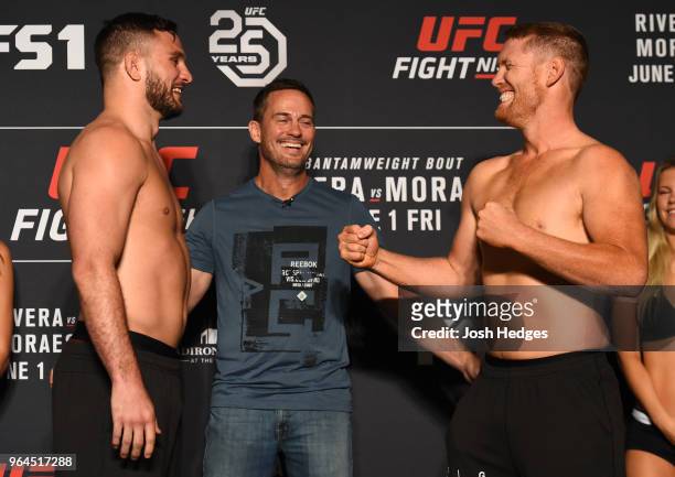 Opponents Gian Villante and Sam Alvey face off during the UFC weigh-in at the DoubleTree Hotel on May 31, 2018 in Utica, New York.