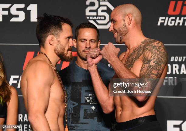 Opponents Jake Ellenberger and Ben Saunders face off during the UFC weigh-in at the DoubleTree Hotel on May 31, 2018 in Utica, New York.