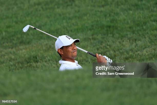 Tiger Woods of the United States hits his third shot on the 13th hole during the first round of The Memorial Tournament Presented by Nationwide at...