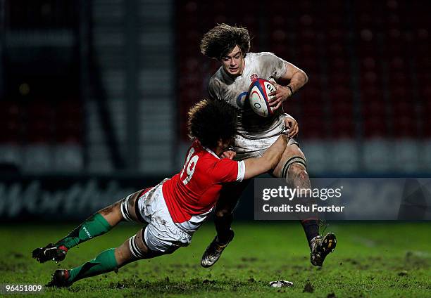 England number 8 Alex Gray breaks the tackle of Wales player Toby Faletau during the International match between England U20 and Wales U20...