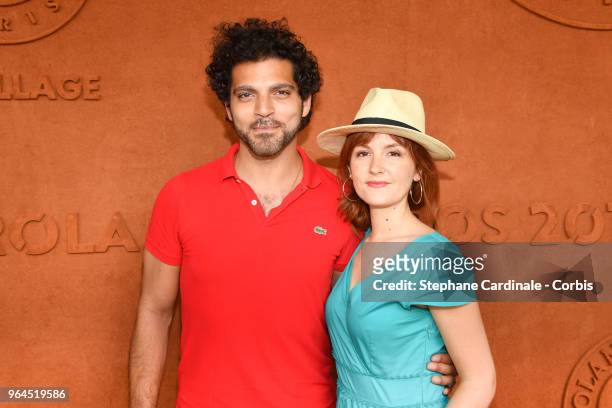 Actors Vincent Heneine and Justine Le Pottier attend the 2018 French Open - Day Five at Roland Garros on May 31, 2018 in Paris, France.