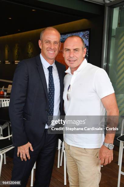 Guy Forget and Alain Boghossian attend the 2018 French Open - Day Five at Roland Garros on May 31, 2018 in Paris, France.