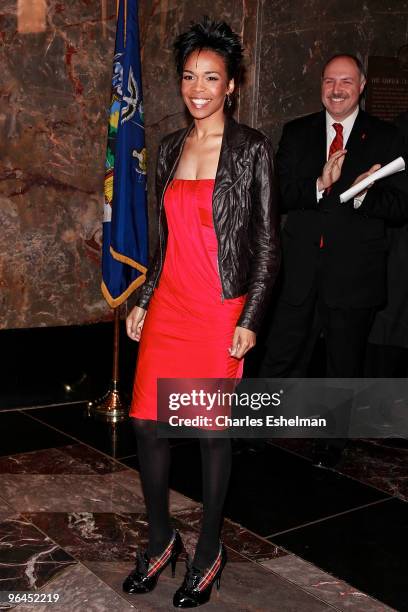 Singer Michelle Williams lights the Empire State Building red for Go Red for Women on February 5, 2010 in New York City.