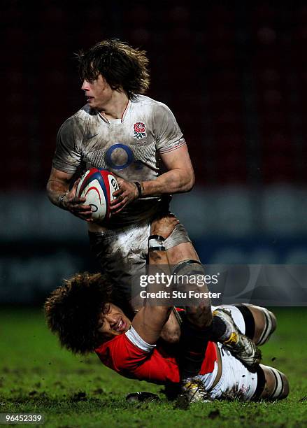 England number 8 Alex Gray breaks the tackle of Wales player Toby Faletau during the International match between England U20 and Wales U20...