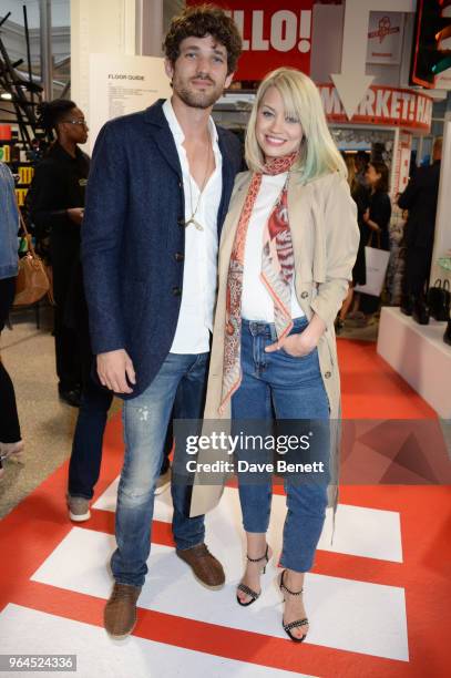 Max Rogers and Kimberly Wyatt attend Hello Magazine's 30th anniversary party at Dover Street Market on May 9, 2018 in London, England.