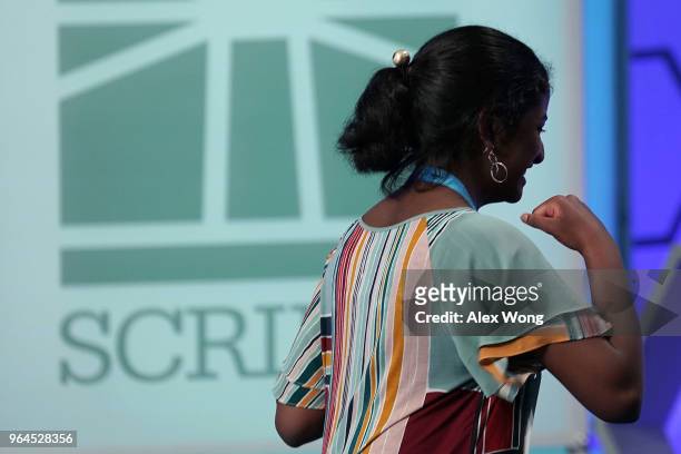 Nilla Rajan of Athens, Ohio, celebrates after she correctly spelled her word during round four of the 91st Scripps National Spelling Bee at the...