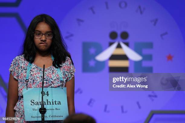 Samhita Kumar of Sacramento, California, tries to spell her word during round four of the 91st Scripps National Spelling Bee at the Gaylord National...