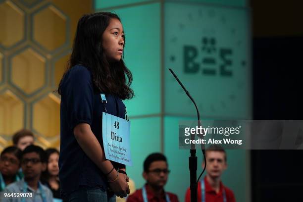 Medina Miranda of Los Angeles, California, tries to spell her word during round four of the 91st Scripps National Spelling Bee at the Gaylord...
