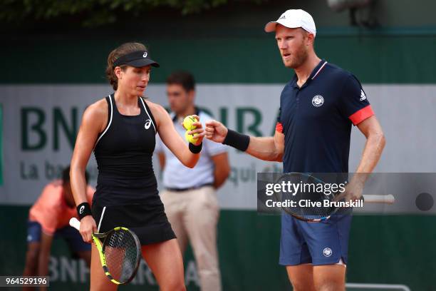 Johanna Konta of Great Britain and partner Dominic Inglot of Great Britain in action during their mixed doubles first round match against Fiona Ferro...