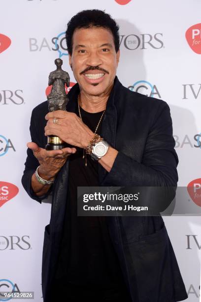 Lionel Richie with the PRs For Music Special International Award, poses in the winner's room during the Ivor Novello Awards 2018 at Grosvenor House,...