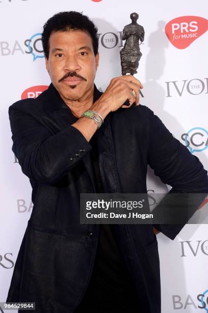 Lionel Richie with the PRs For Music Special International Award, poses in the winner's room during the Ivor Novello Awards 2018 at Grosvenor House,...