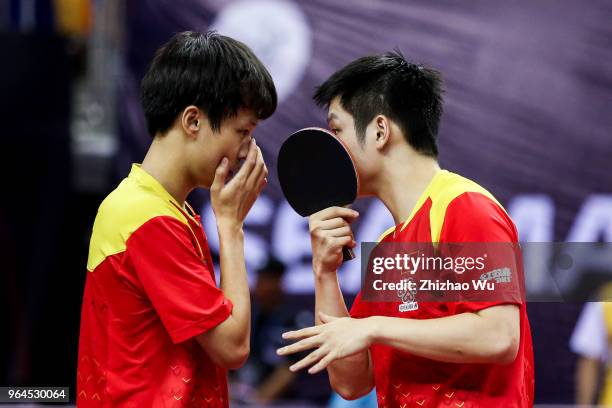 Fan Zhendong and Lin Gaoyuan of China in action at the men's doubles match compete with Lam Siu Hang and Ng Pak Nam of Hong Kong China during the...