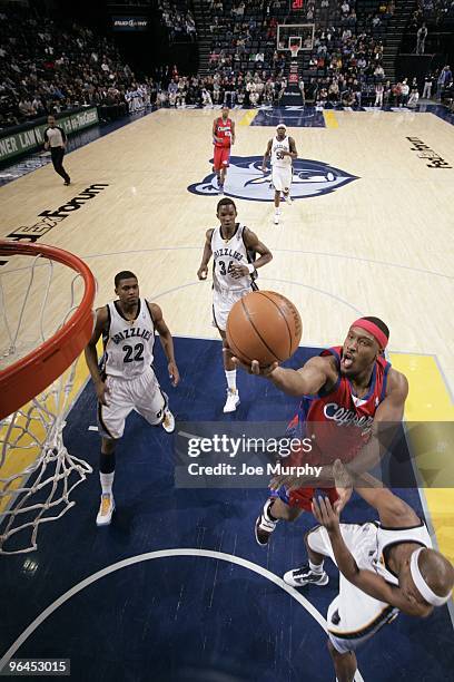 Craig Smith of the Los Angeles Clippers shoots a layup against Jamaal Tinsley of the Memphis Grizzlies during the game at the FedExForum on January...