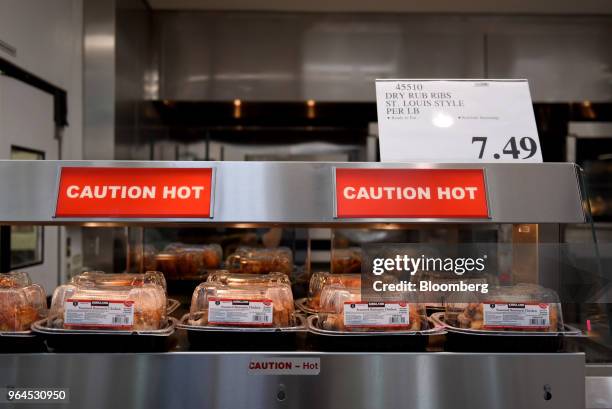 Rotisserie chickens sit on display for sale at a Costco Wholesale Corp. Store in San Antonio, Texas, U.S., on Wednesday, May 30, 2018. Costco...