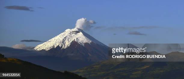 The Cotopaxi volcano emits water vapour and gases as seen from Quito on May 31, 2018.