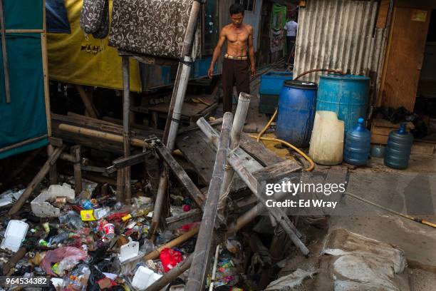 The water on which a seaside neighborhood is built, is completely obscured by plastic waste on May 30, 2018 in Jakarta, Indonesia. Indonesia has been...