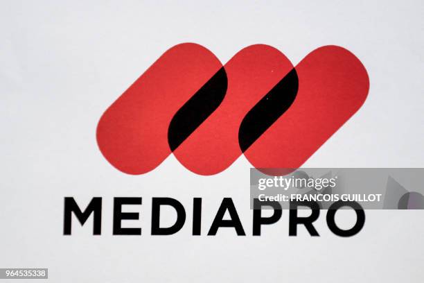 Spain's Barcelona-based production company Mediapro logo is pictured during a press conference on May 31, 2018 in Paris, two days after the group won...